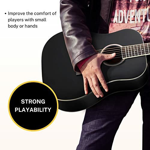 Person holding a black acoustic guitar with text promoting strong playability.