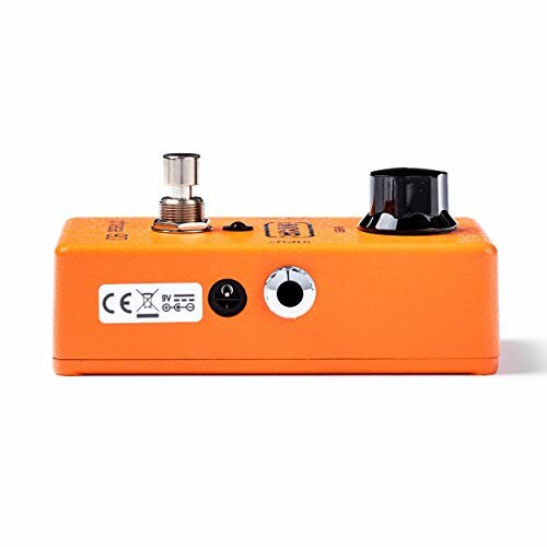 Side view of an orange guitar effects pedal with control knob and input jacks.